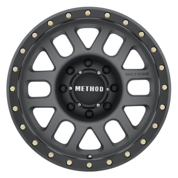 Method mr309 grid 18x9 titanium/black street loc wheel with gold rivets.