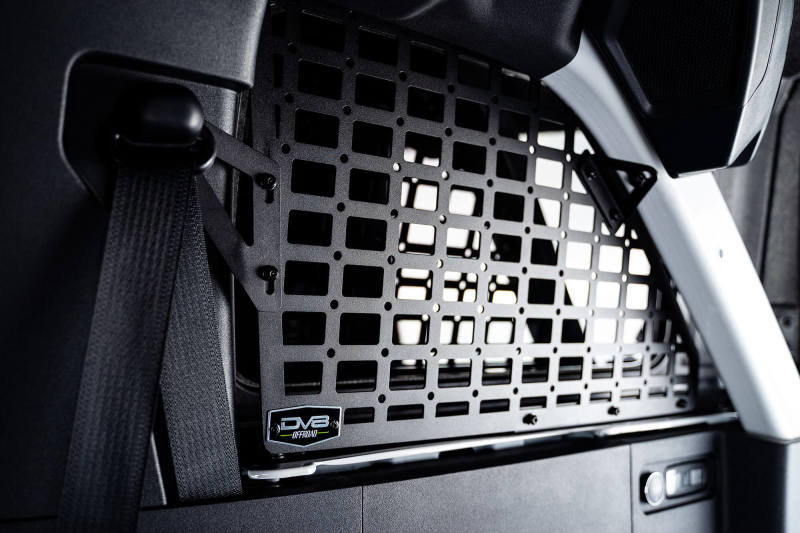 Interior of a car featuring metal grille on dv8 21-23 ford bronco rear window molle panels