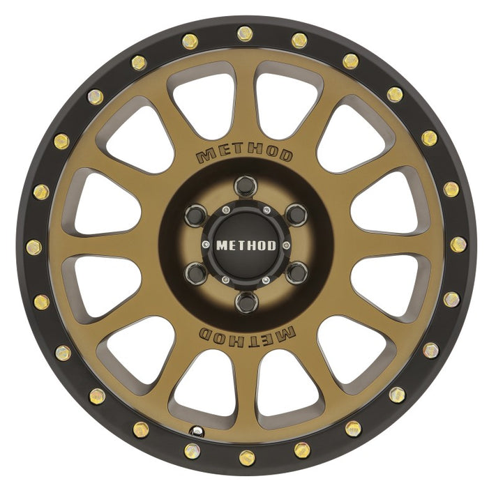 Black and gold fly fishing reel displayed on method mr305 nv 18x9 wheel.